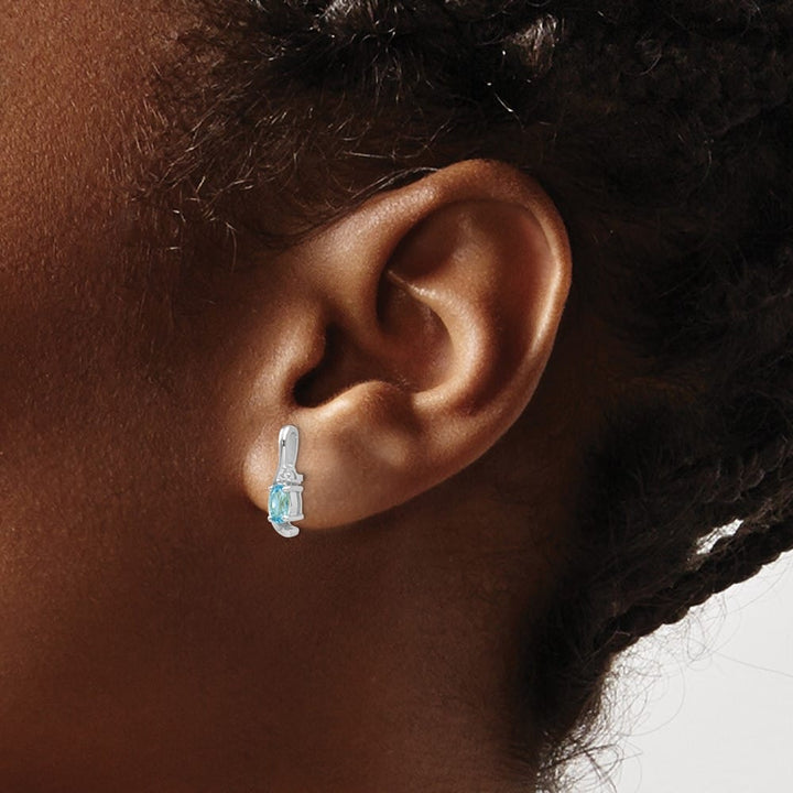 14K White Gold 5x3 Oval December/Blue Topaz and Diamond Post Earrings, view 3 of 4