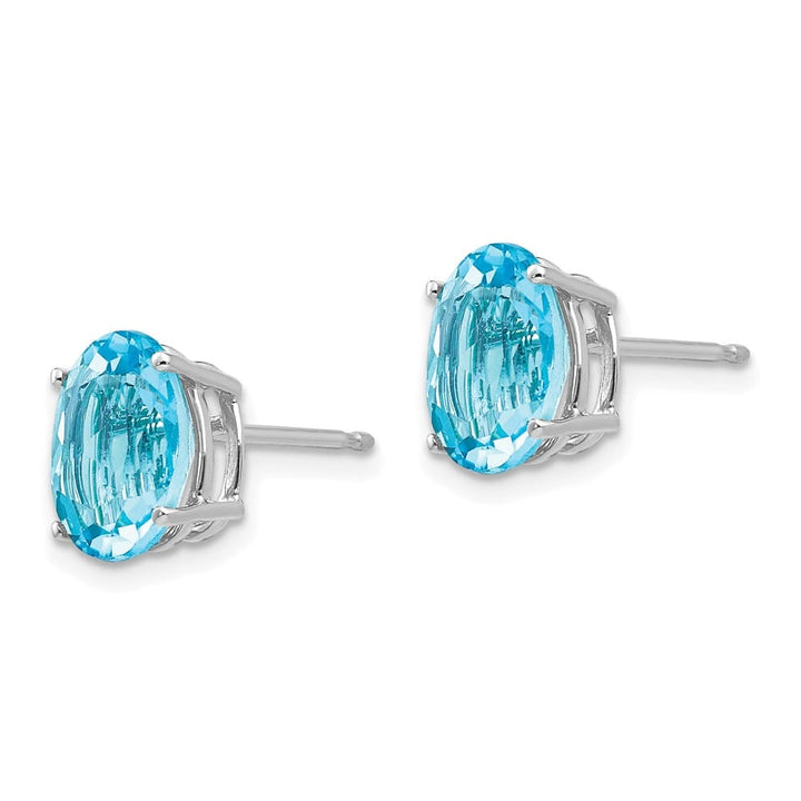 14K White Gold 9x7mm Oval Blue Topaz Post Earrings, view 2 of 4