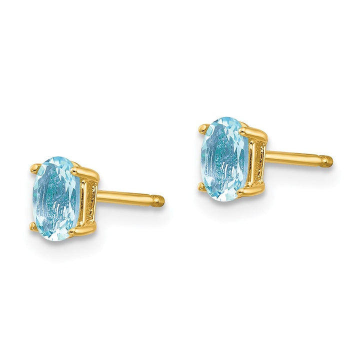 14K Yellow Gold 5x3mm Oval Aquamarine Post Earrings, view 2 of 4