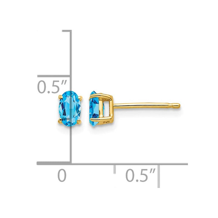 14K Yellow Gold 5x3mm Oval Blue Topaz Post Earrings, view 4 of 4