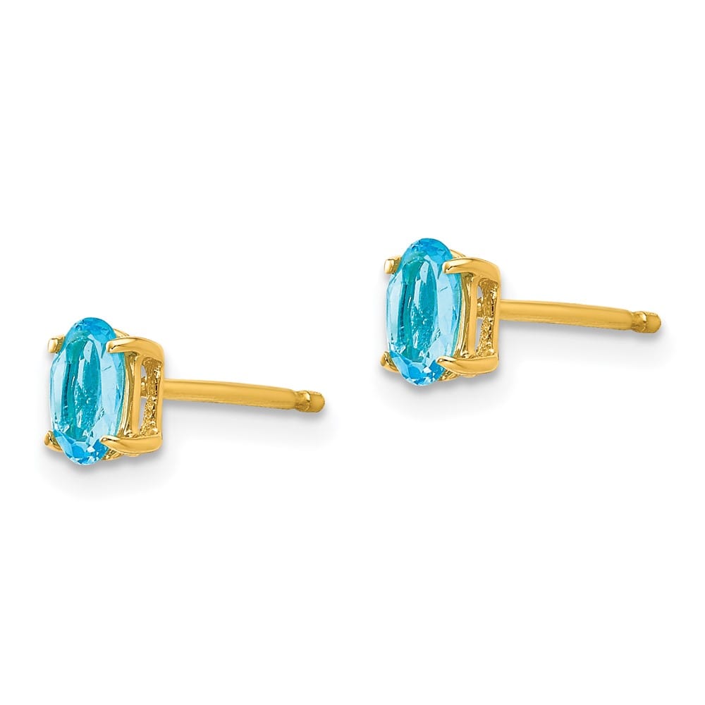 14K Yellow Gold 5x3mm Oval Blue Topaz Post Earrings, view 2 of 4