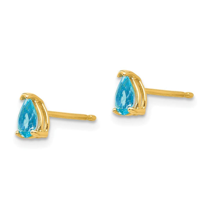 14K Yellow Gold 5x3mm Pear Blue Topaz Post Earrings, view 2 of 4