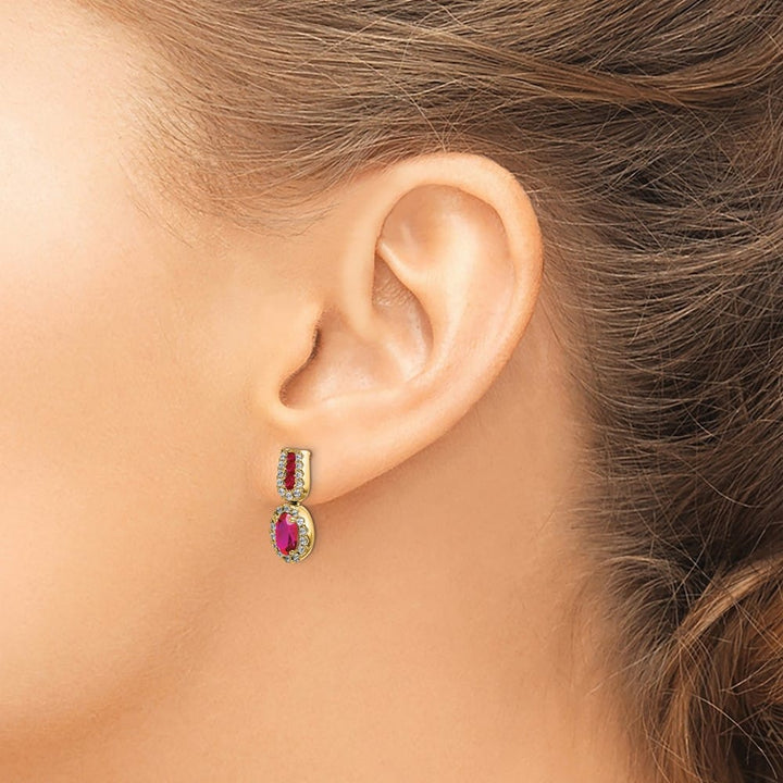 14K Yellow Gold 6x4mm Oval Ruby and Diamond Halo Post Earrings, view 3 of 4
