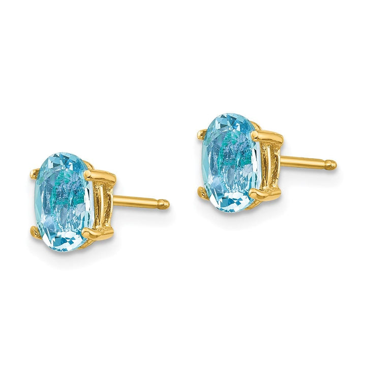 14K Yellow Gold 7x5mm Oval Aquamarine Post Earrings, view 2 of 4