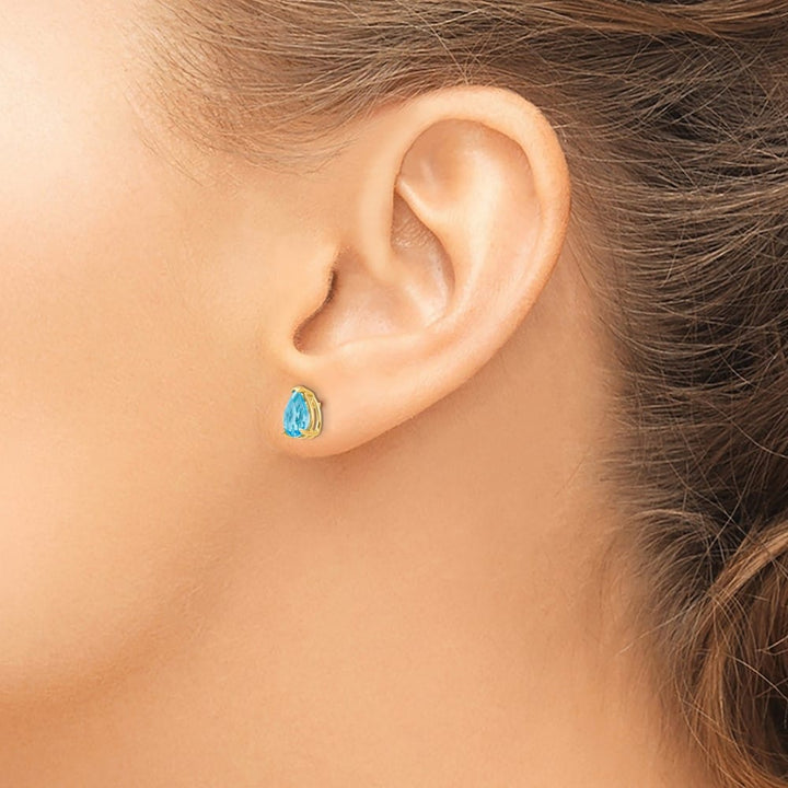 14K Yellow Gold 7x5mm Pear Blue Topaz Post Earrings, view 3 of 4