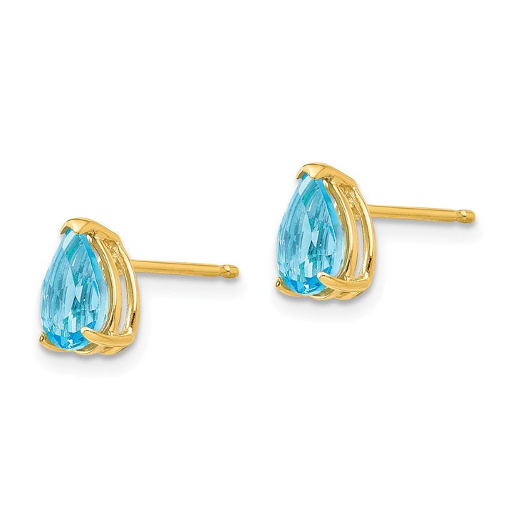 14K Yellow Gold 7x5mm Pear Blue Topaz Post Earrings, view 2 of 4