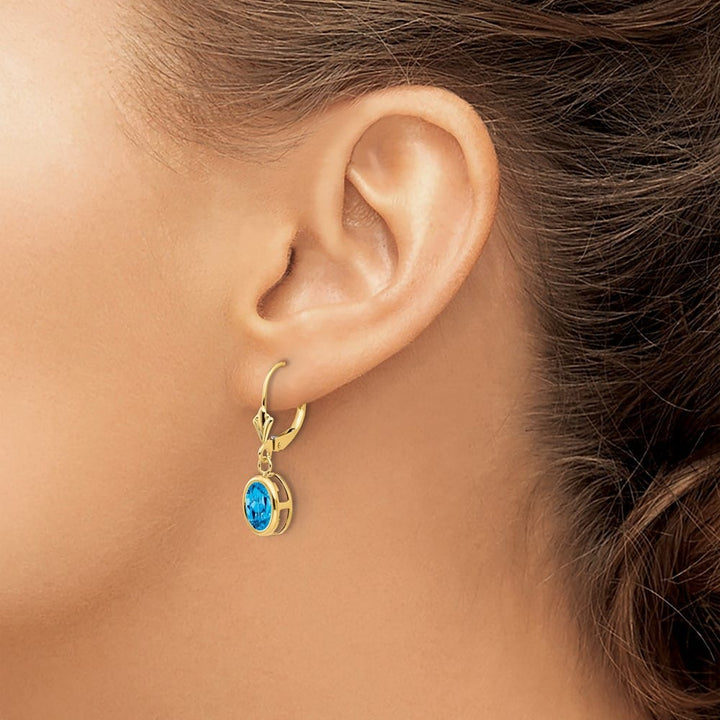 14K Yellow Gold 8x6mm Oval Bezel Leverback Dangle Earrings, Swiss Blue Topaz, view 15 of 24