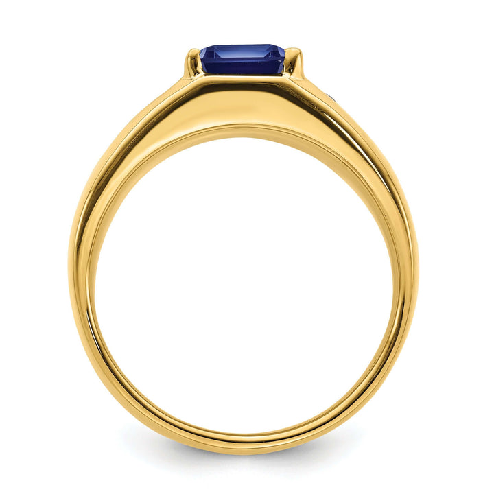 14k yellow gold men's ring with an emerald-cut created sapphire and diamond accents, showcasing a polished finish from the side view.