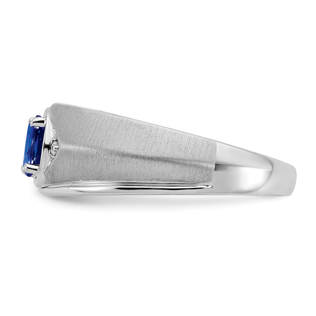 14k white gold men's ring with an oval sapphire and diamond accents, showcasing a sleek side profile view with a rich blue gemstone.